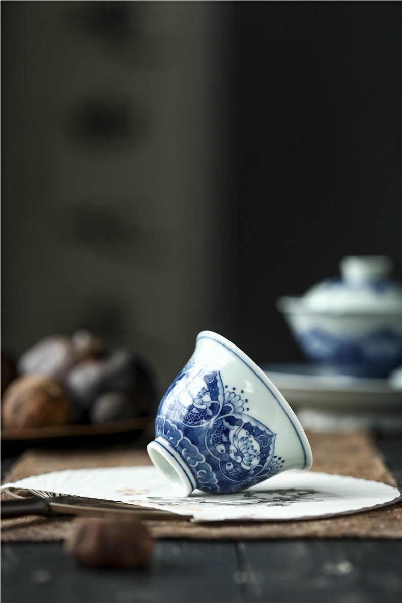 Antique-Style Hand-Painted Wood-Fired Blue & White Teacup – Fish & Lotus Motif
