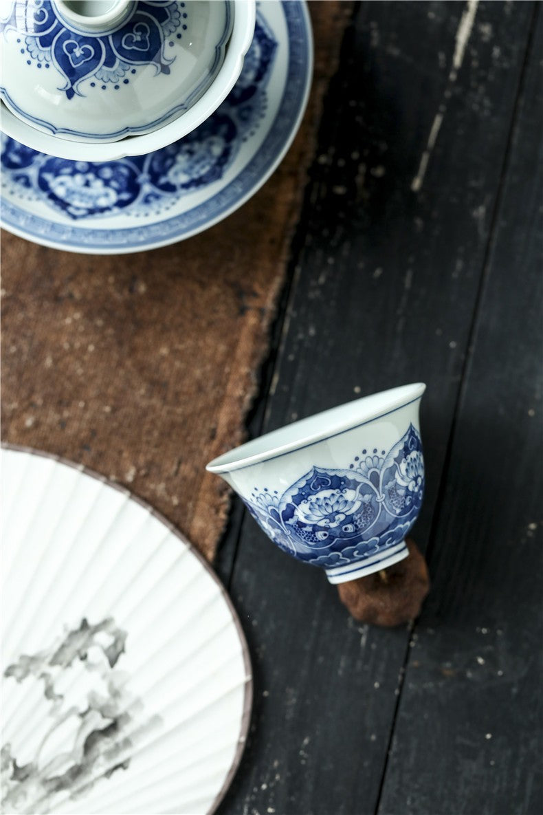 Antique-Style Hand-Painted Wood-Fired Blue & White Teacup – Fish & Lotus Motif