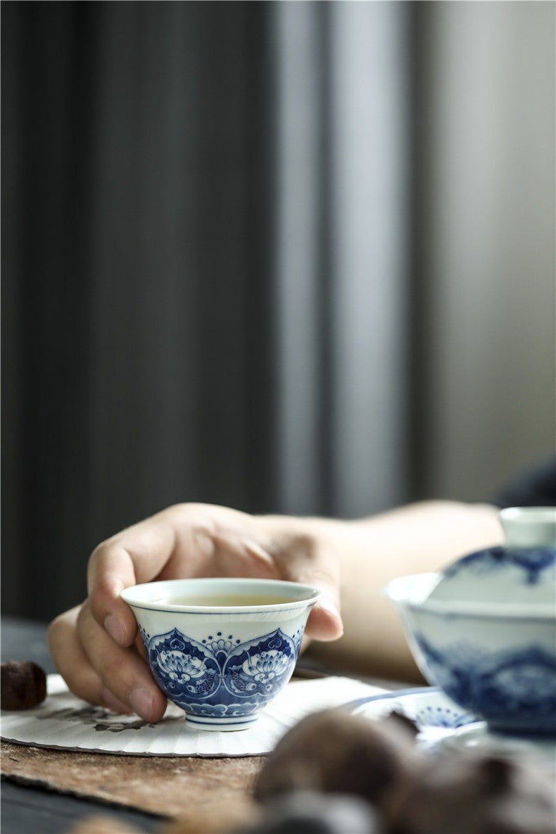 Antique-Style Hand-Painted Wood-Fired Blue & White Teacup – Fish & Lotus Motif