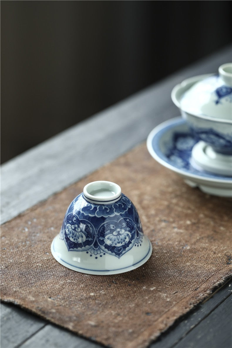 Antique-Style Hand-Painted Wood-Fired Blue & White Teacup – Fish & Lotus Motif
