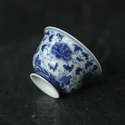 Antique-Style Hand-Painted Blue & White Teacup – Interlocking Peony Motif