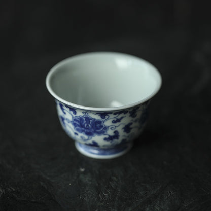 Antique-Style Hand-Painted Blue & White Teacup – Interlocking Peony Motif