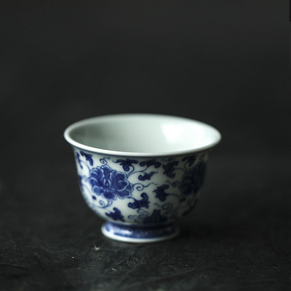 Antique-Style Hand-Painted Blue & White Teacup – Interlocking Peony Motif