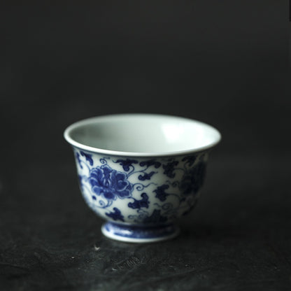 Antique-Style Hand-Painted Blue & White Teacup – Interlocking Peony Motif
