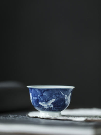 Antique-Style Hand-Painted Blue & White Teacup – Butterfly Motif