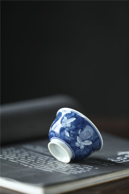 Antique-Style Hand-Painted Blue & White Teacup – Butterfly Motif