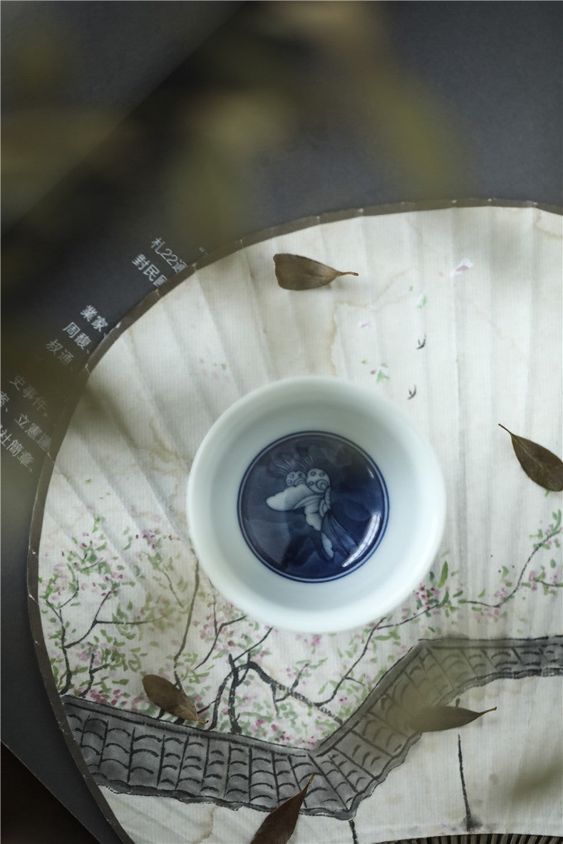 Antique-Style Hand-Painted Blue & White Teacup – Butterfly Motif