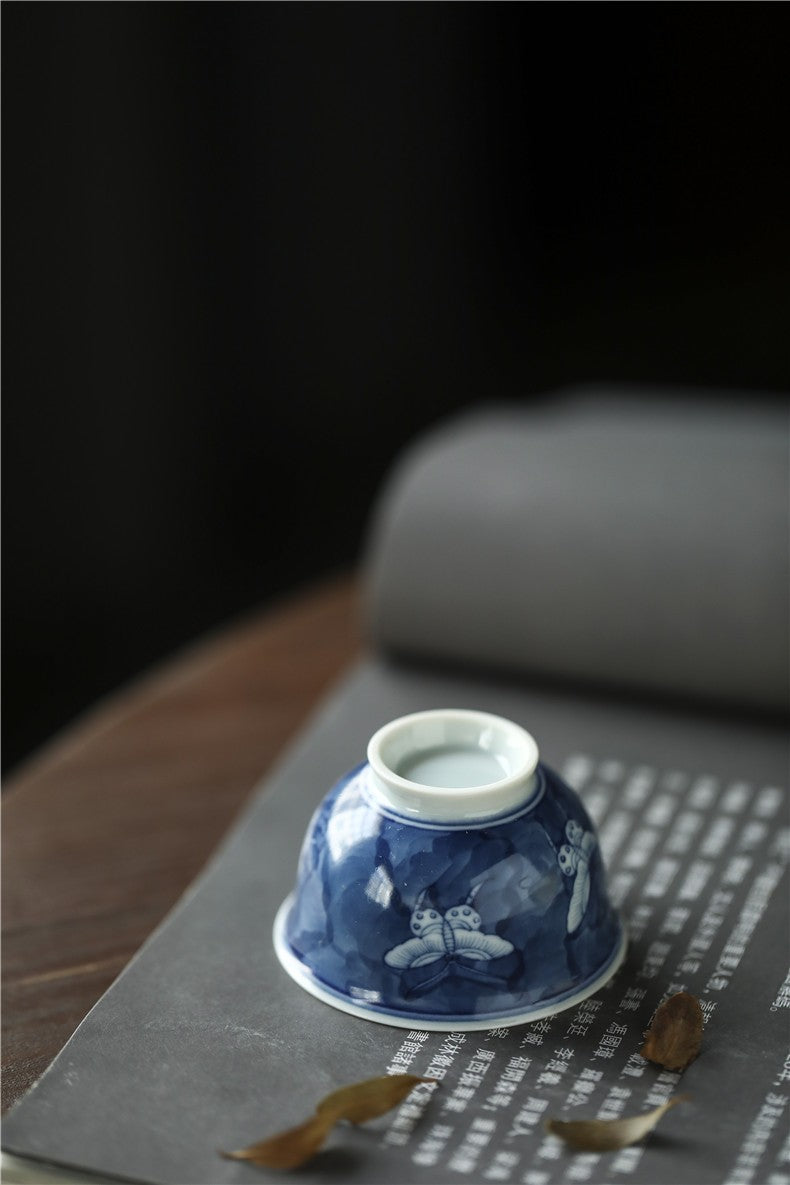Antique-Style Hand-Painted Blue & White Teacup – Butterfly Motif