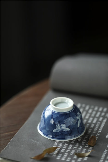 Antique-Style Hand-Painted Blue & White Teacup – Butterfly Motif