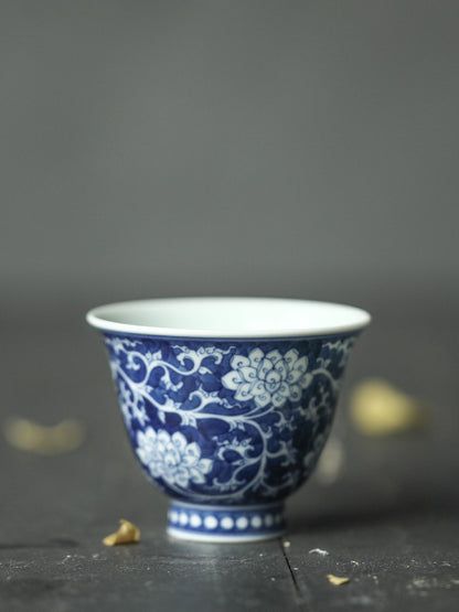 Jingdezhen Antique-Style Hand-Painted Wood-Fired Blue & White Teacup – Negative Space Interlocking Lotus Motif