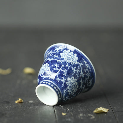 Jingdezhen Antique-Style Hand-Painted Wood-Fired Blue & White Teacup – Negative Space Interlocking Lotus Motif