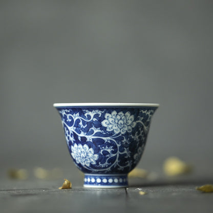 Jingdezhen Antique-Style Hand-Painted Wood-Fired Blue & White Teacup – Negative Space Interlocking Lotus Motif