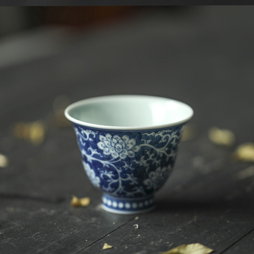 Jingdezhen Antique-Style Hand-Painted Wood-Fired Blue & White Teacup – Negative Space Interlocking Lotus Motif