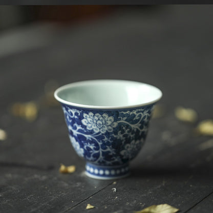 Jingdezhen Antique-Style Hand-Painted Wood-Fired Blue & White Teacup – Negative Space Interlocking Lotus Motif