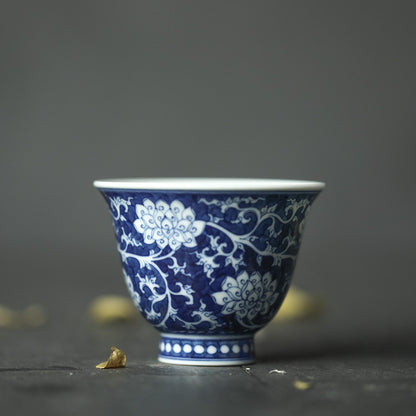 Jingdezhen Antique-Style Hand-Painted Wood-Fired Blue & White Teacup – Negative Space Interlocking Lotus Motif