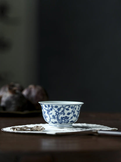 Jingdezhen Antique-Style Hand-Painted Blue & White Teacup – Stippled Dragon & Floral Motif