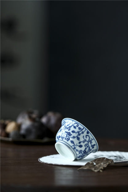 Jingdezhen Antique-Style Hand-Painted Blue & White Teacup – Stippled Dragon & Floral Motif