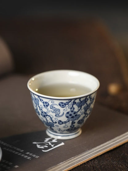 Jingdezhen Antique-Style Hand-Painted Wood-Fired Blue & White Ruyi Cup – Full-Coverage Bats & Gourds Motif