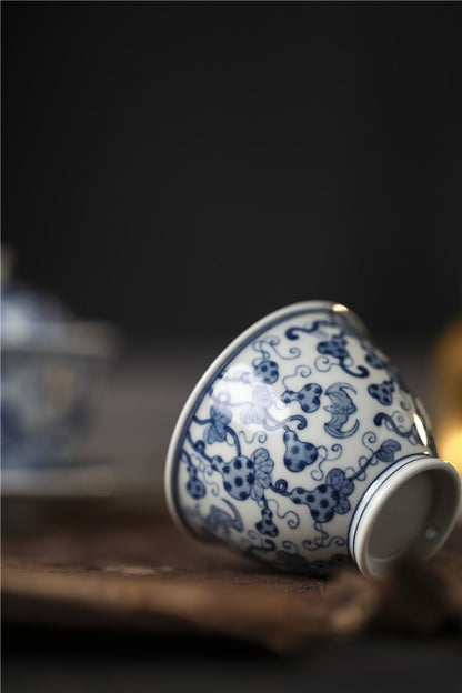 Jingdezhen Antique-Style Hand-Painted Wood-Fired Blue & White Ruyi Cup – Full-Coverage Bats & Gourds Motif